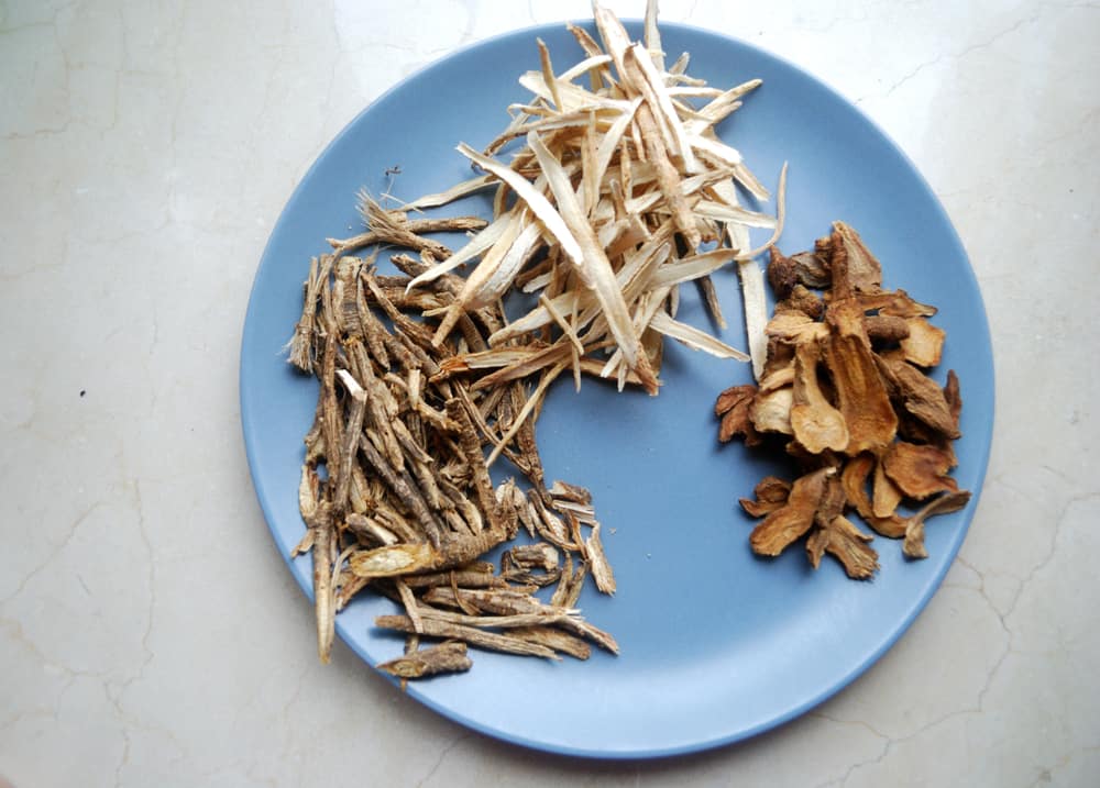 Assorted Chinese Traditional Medicine Herbs On A Plate