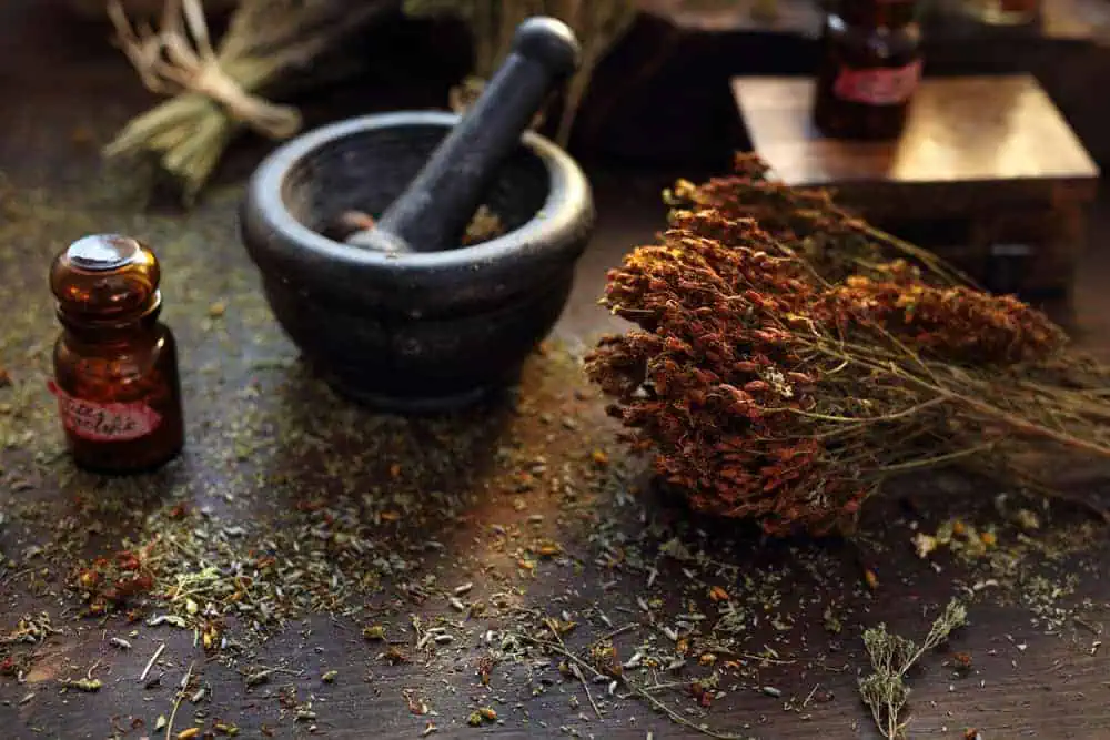 herbal medicine being prepared in a mortar